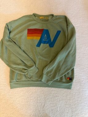 Aviator Nation Sage Green Crewneck Sweatshirt with Blue Logo and Rainbow Stripe